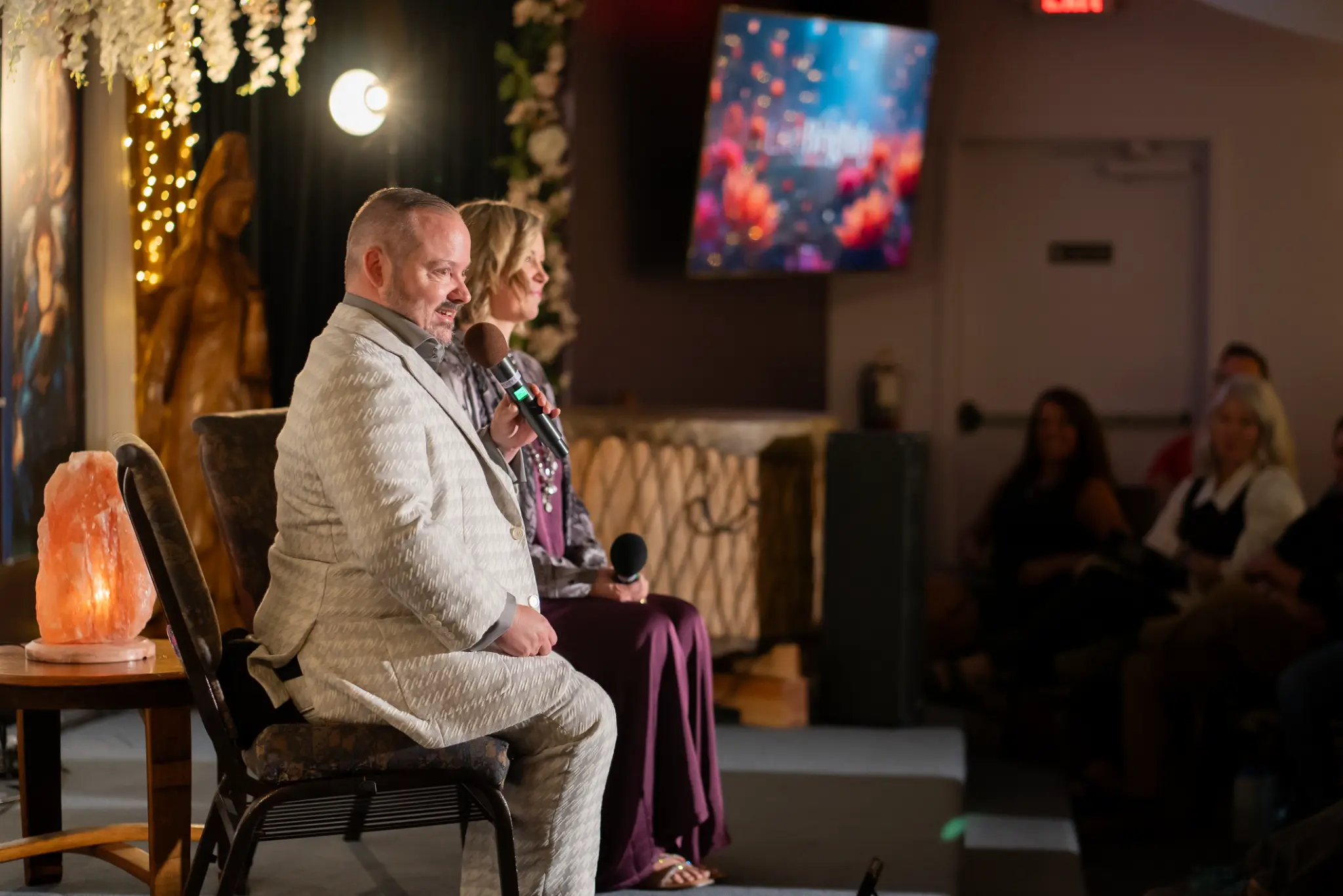 Matt & Joy on stage at a live event venue